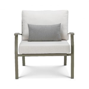 green lounge armchair with white cushions